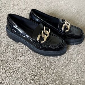 Aldo Glossy Black Loafers with Bold Gold Chain
